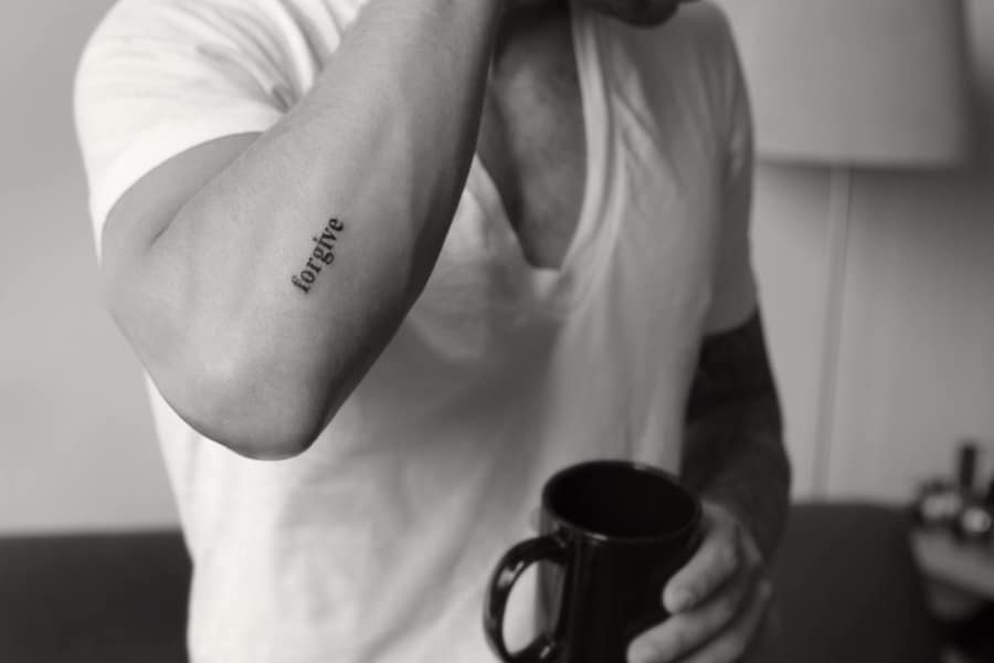 Simple Cute “Forgive” Text Tattoo Tattoo on skin