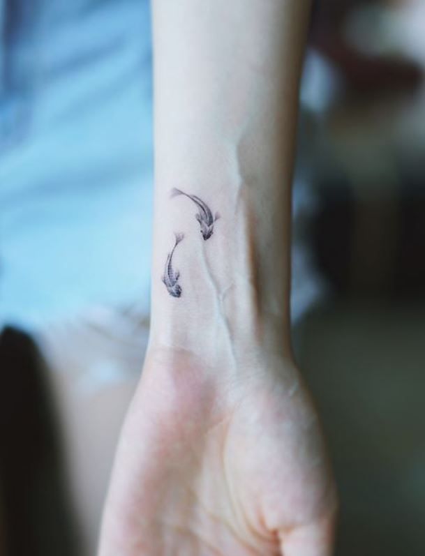 Simple Fish Tattoo Tattoo on skin