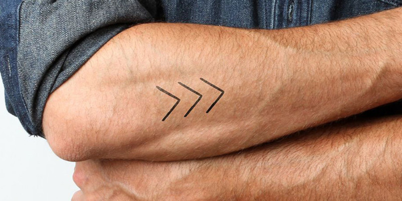 Three Lines Creating Arrows Tattoo Tattoo on skin