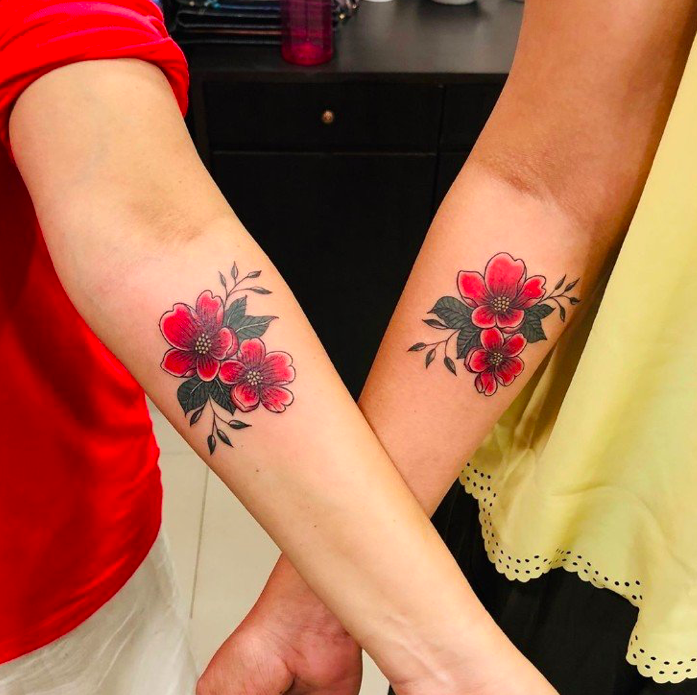 Matching Pink Flower Tattoo Design Tattoo on skin
