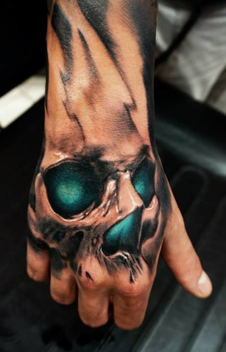 Awesome skull tattoo on a guy’s hand Tattoo on skin