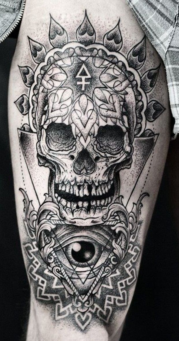 Cool skull tattoo on a guy’s upper arm Tattoo on skin