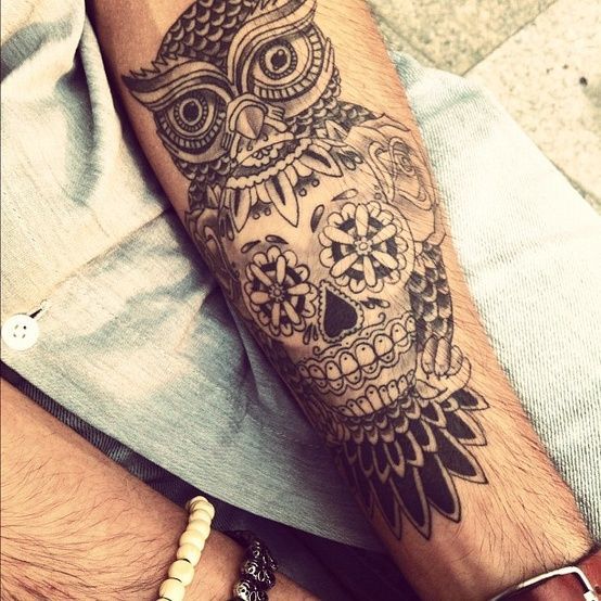 Cool tattoo with a skull on a guy’s arm Tattoo on skin