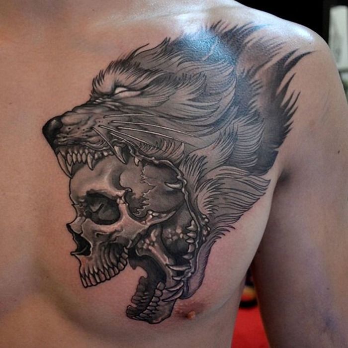 Awesome wolf skull tattoo on a guy’s breast Tattoo on skin