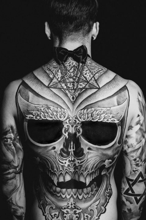 Epic skull tattoo on a guy’s back Tattoo on skin