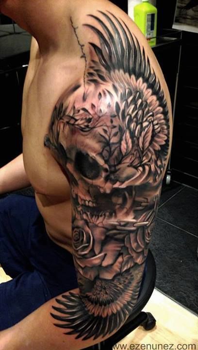 Large black and white skull tattoo on a guy’s back Tattoo on skin
