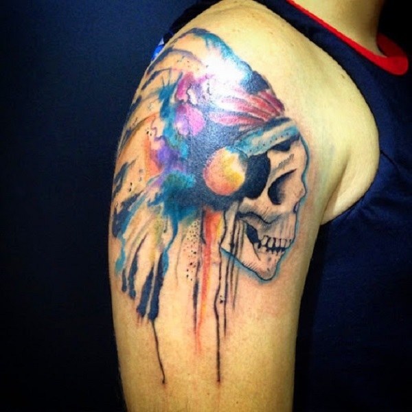Multi-colored Aztec skull tattoo on arm Tattoo on skin