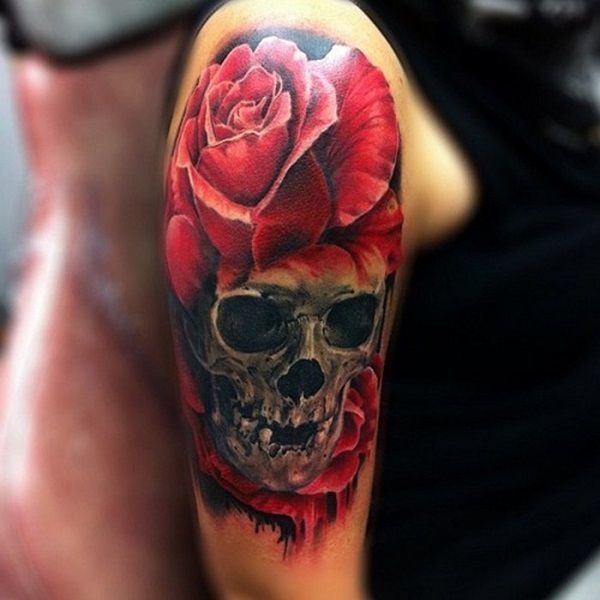 Stunning and realistic arm tattoo with a rose and a skull Tattoo on skin