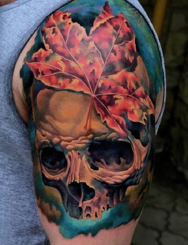 Autumn or Halloween inspired skull tattoo on arm Tattoo on skin