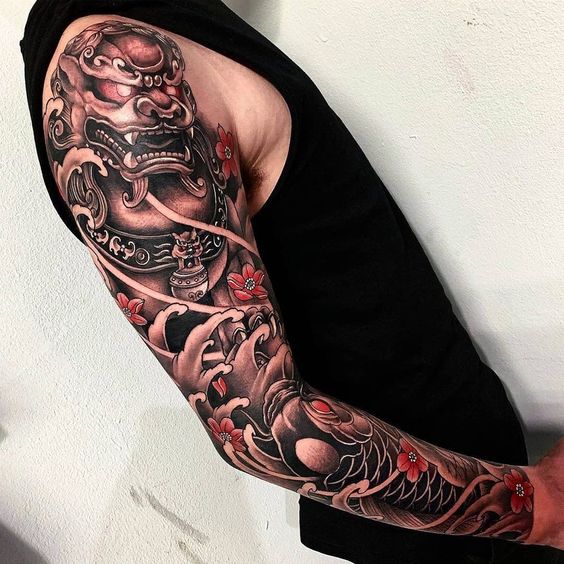 Jaguar and Scales Under Waves and Flowers Sleeve Tattoo Tattoo on skin