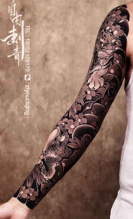 Jungle Cat and Frog with Floral Backdrop Sleeve Tattoo Tattoo on skin