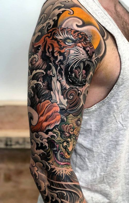 Snarling Tiger and Green Mask Sleeve Tattoo Ideas Tattoo on skin
