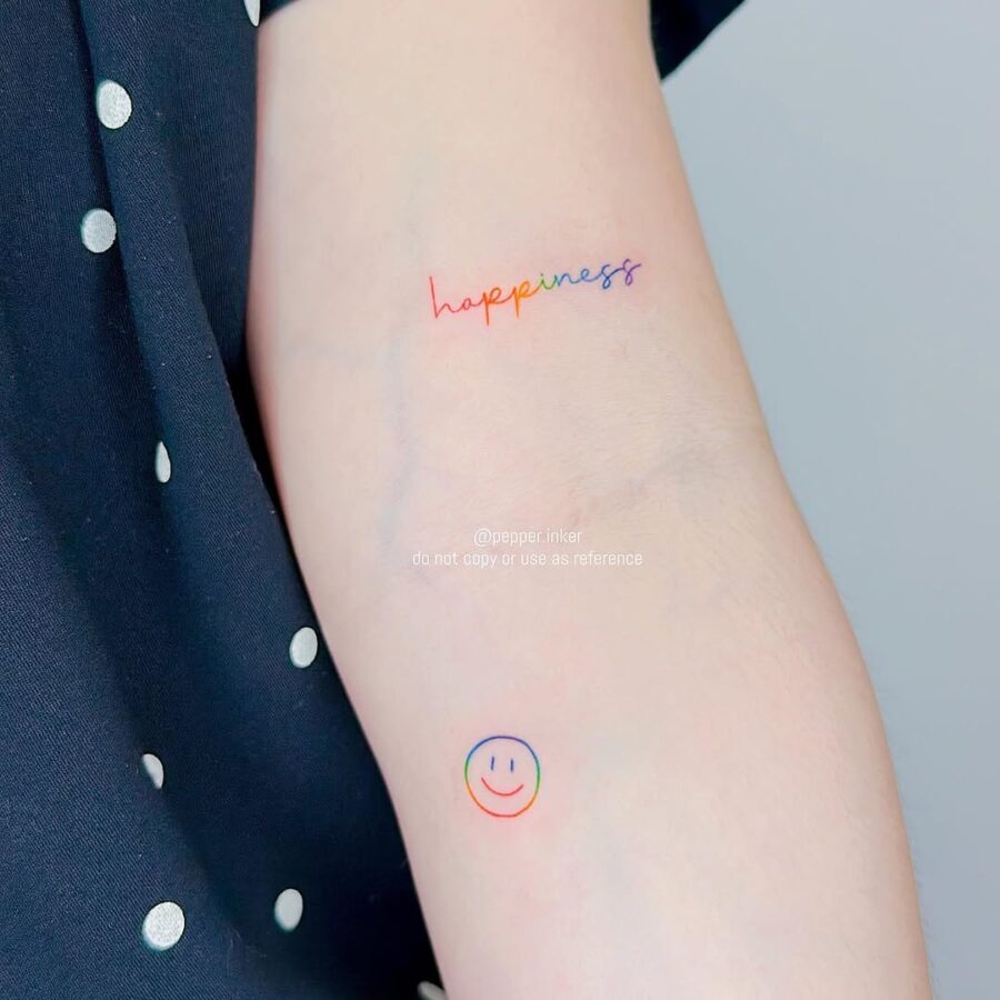 Bright and cheerful smiley face tattoo design Tattoo on skin