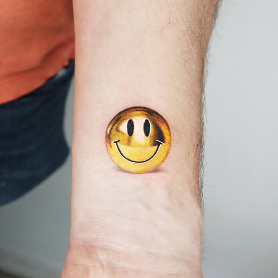 Charming and cheerful smiley face tattoo Tattoo on skin