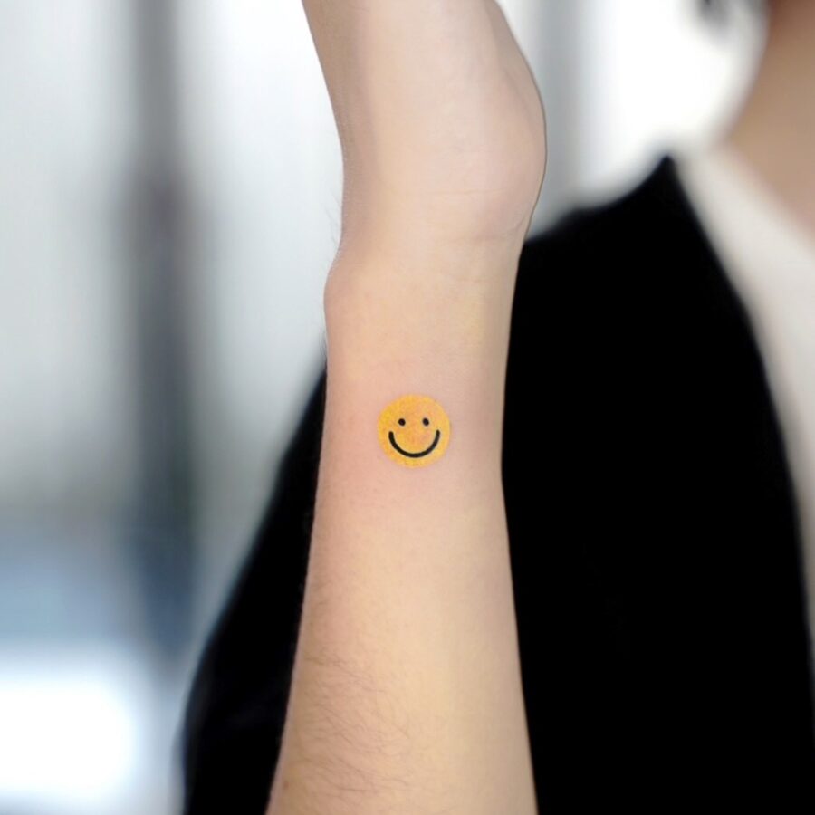 Charming Smiley Face Tattoo on Forearm Tattoo on skin