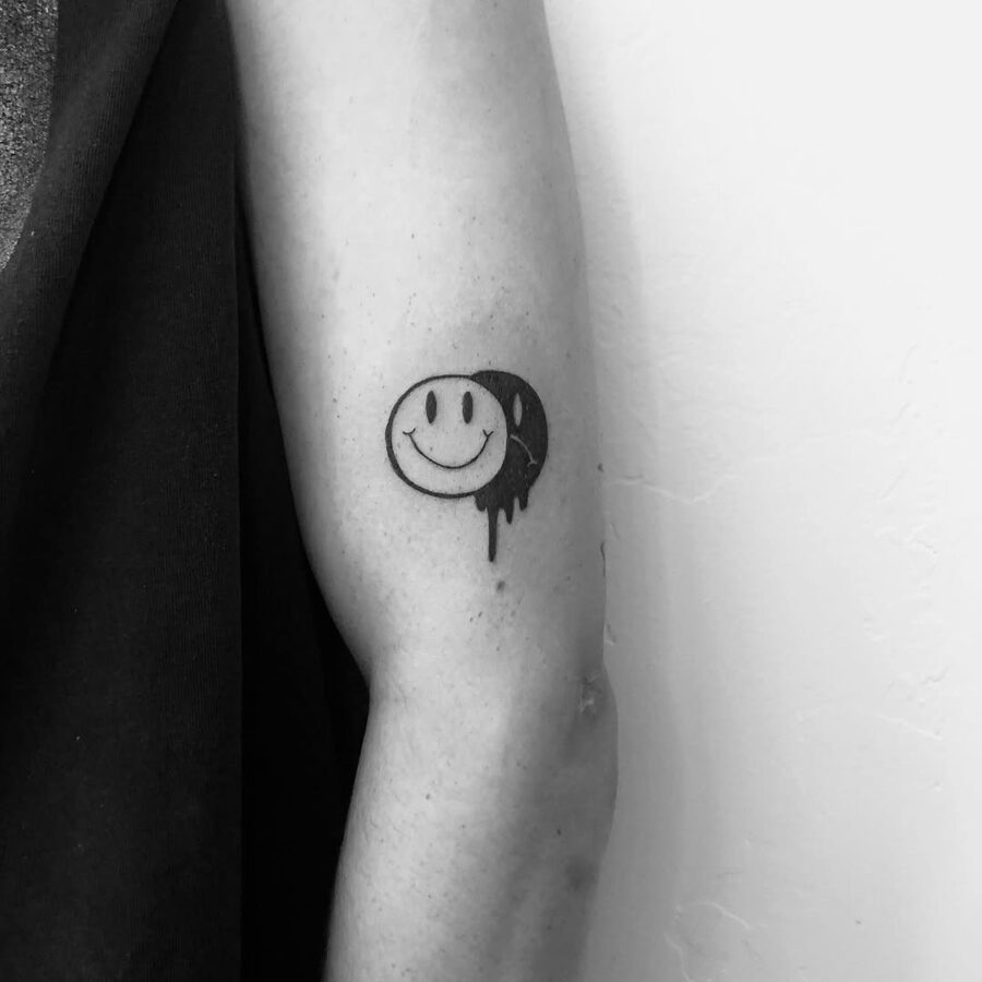 Charming smiley face tattoo with artistic flair Tattoo on skin