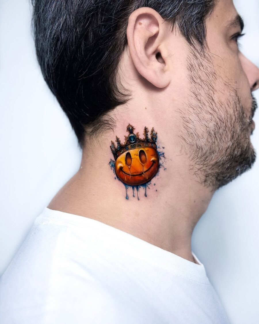 Colorful smiley neck tattoo with a crown Tattoo on skin