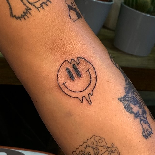 Minimalist Droplet Smiley Face Tattoo Design Tattoo on skin