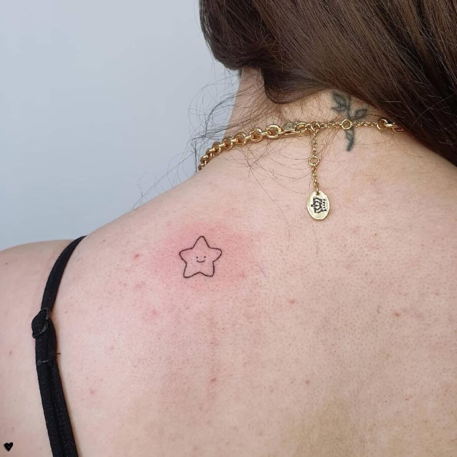 Minimalist star tattoo for a playful vibe smiley face tattoos