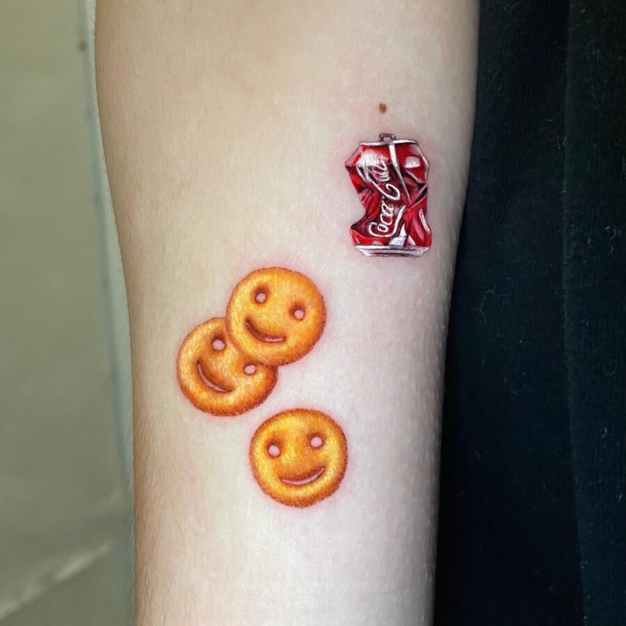 Whimsical smileys with a classic soda twist Tattoo on skin