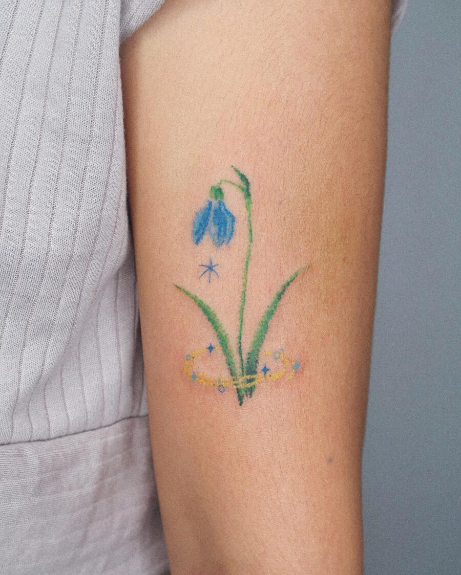 Delicate Snowdrop Flower Tattoo with Whimsical Touch Tattoo on skin