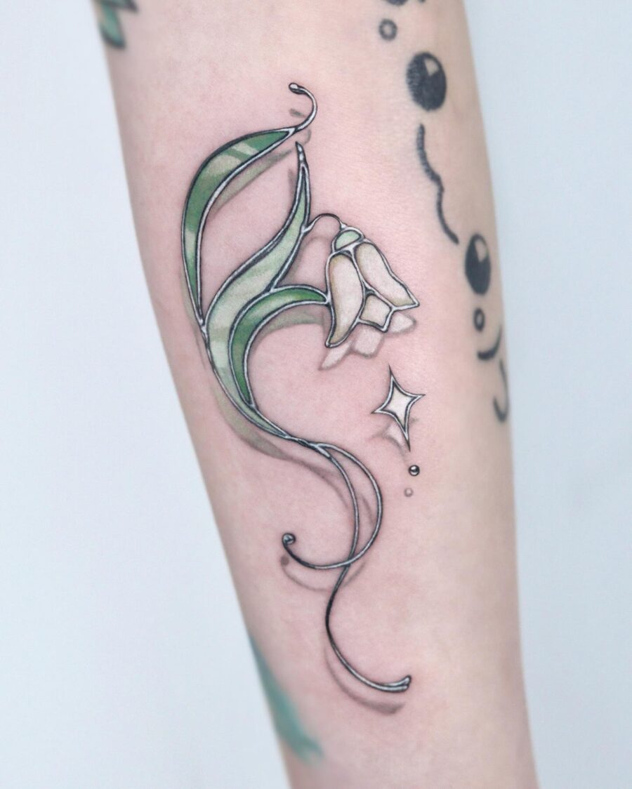 Delicate snowdrop tattoo with elegant lines Tattoo on skin