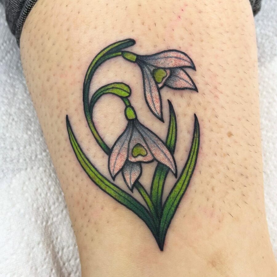 Delicate snowdrop tattoo with floral elegance Tattoo on skin