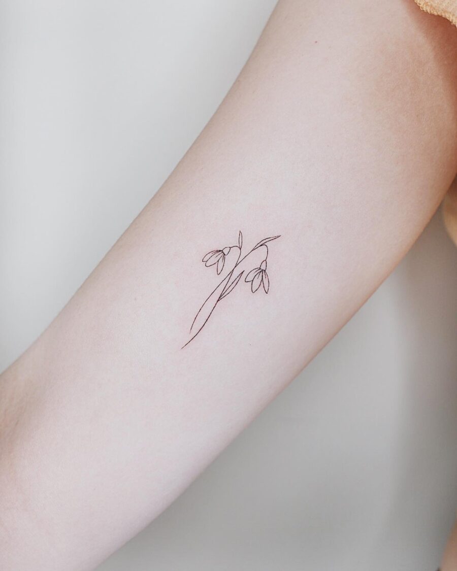 Elegant Minimalist Snowdrop Flower Tattoo Design Tattoo on skin