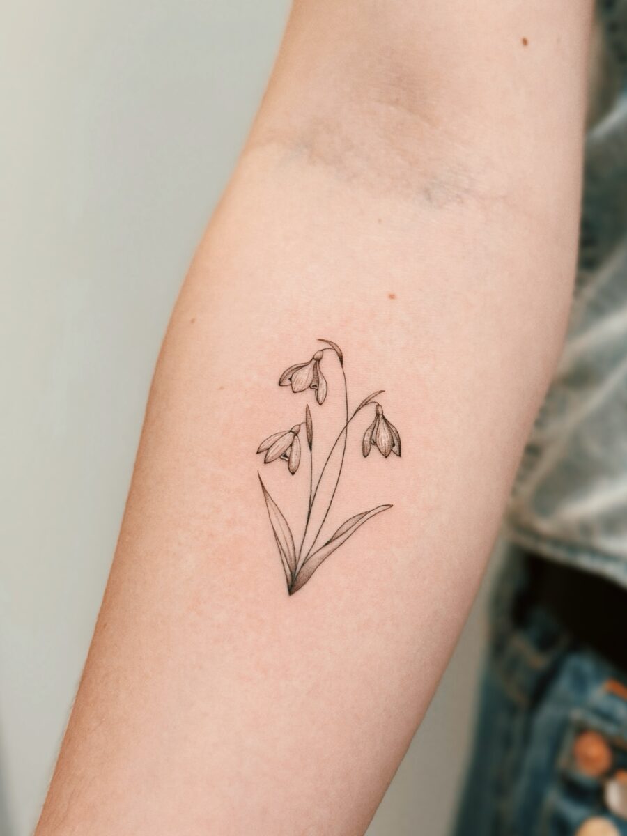 Elegant snowdrop tattoo for nature lovers Tattoo on skin