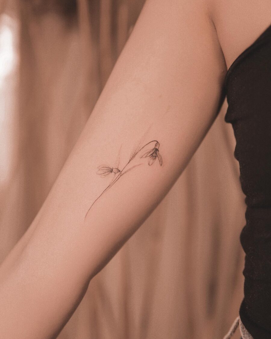 Elegant snowdrop tattoo inspiring subtle beauty Tattoo on skin