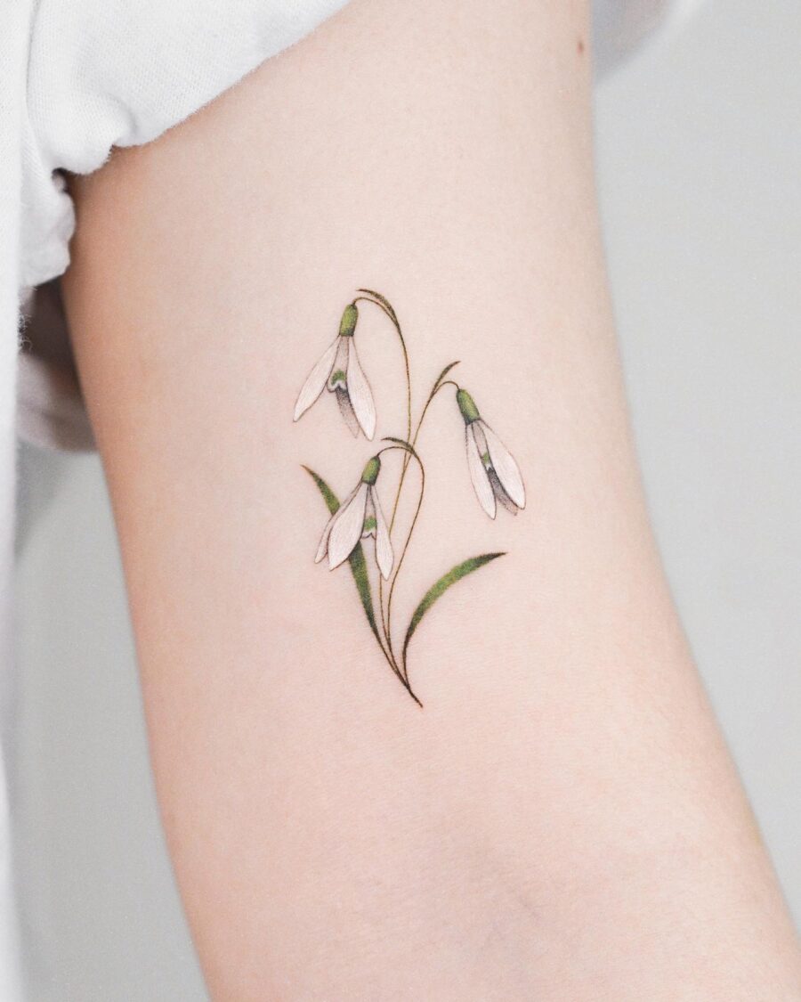 Elegant snowdrop tattoo showcasing soft colors Tattoo on skin