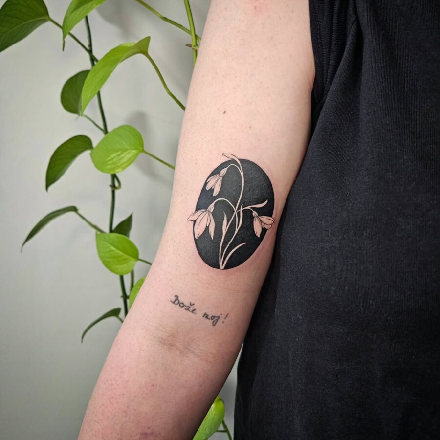 Elegant snowdrop tattoo with intricate details Tattoo on skin