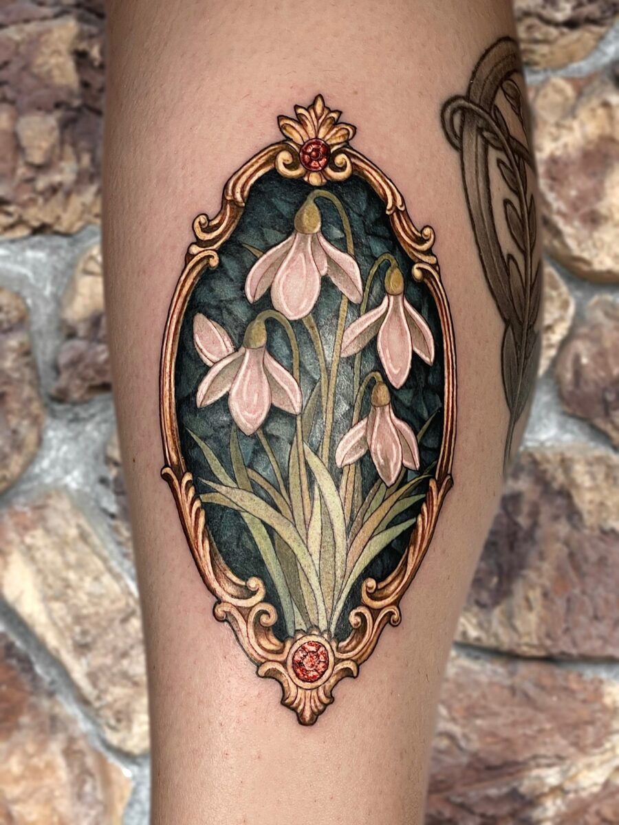 Elegant vintage snowdrop tattoo with intricate detailing Tattoo on skin