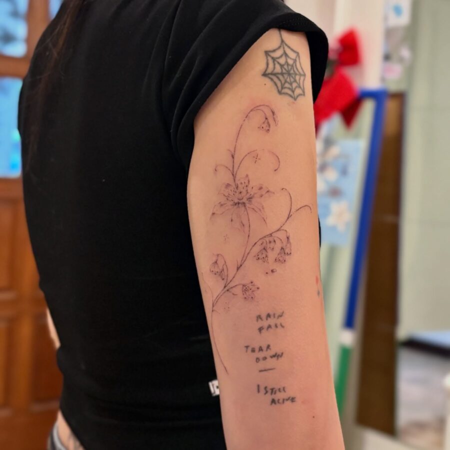 Feminine snowdrop flower tattoo with delicate details Tattoo on skin