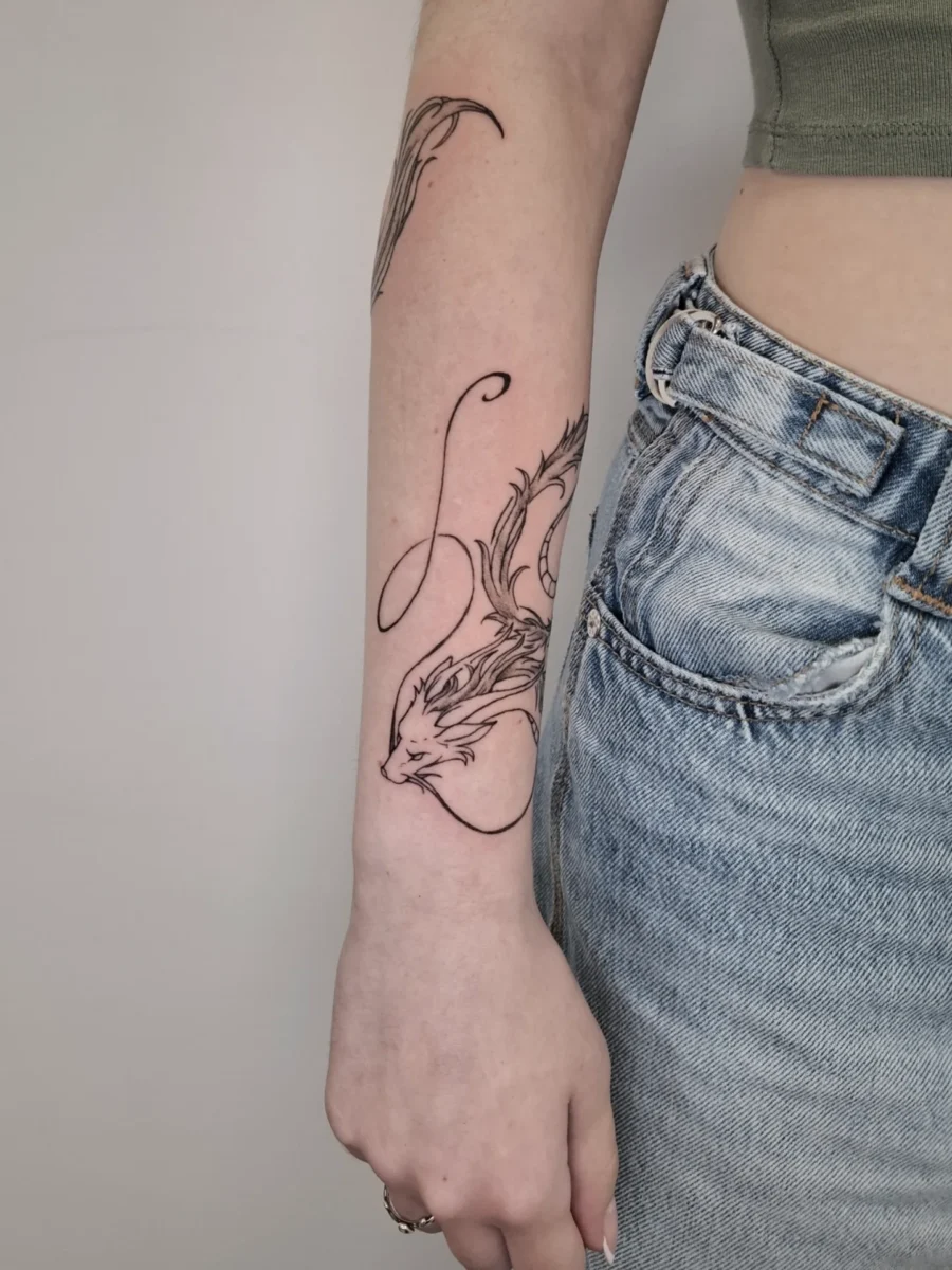 Elegant dragon tattoo inspired by Spirited Away Tattoo on skin