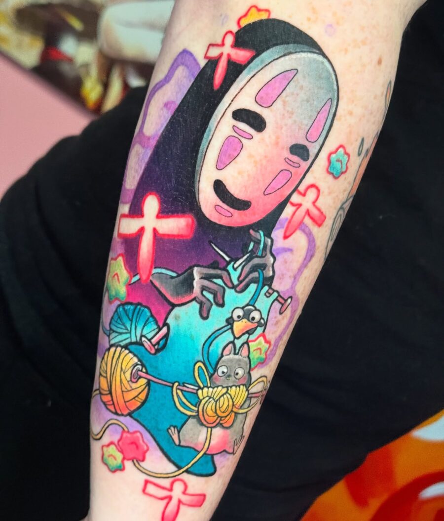 No Face amidst vibrant Spirited Away elements Tattoo on skin