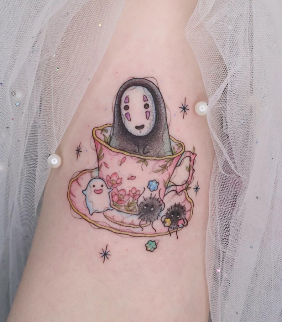 Whimsical No-Face Tea Cup Tattoo Delight Tattoo on skin