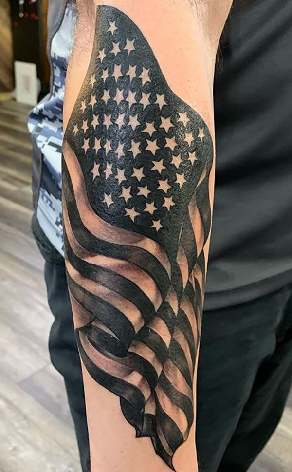 Black and White Tattoo of American Flag Tattoo on skin