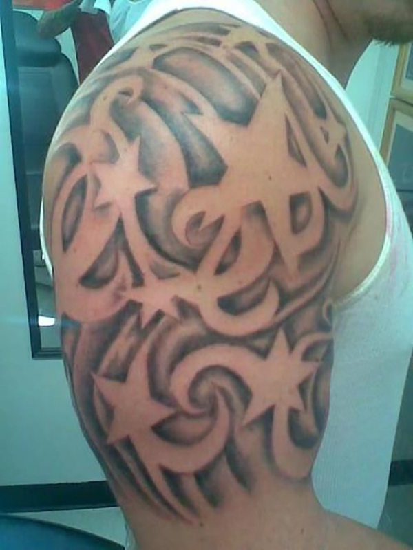 Negative Space Star Tattoo and Swirls Tattoo on skin