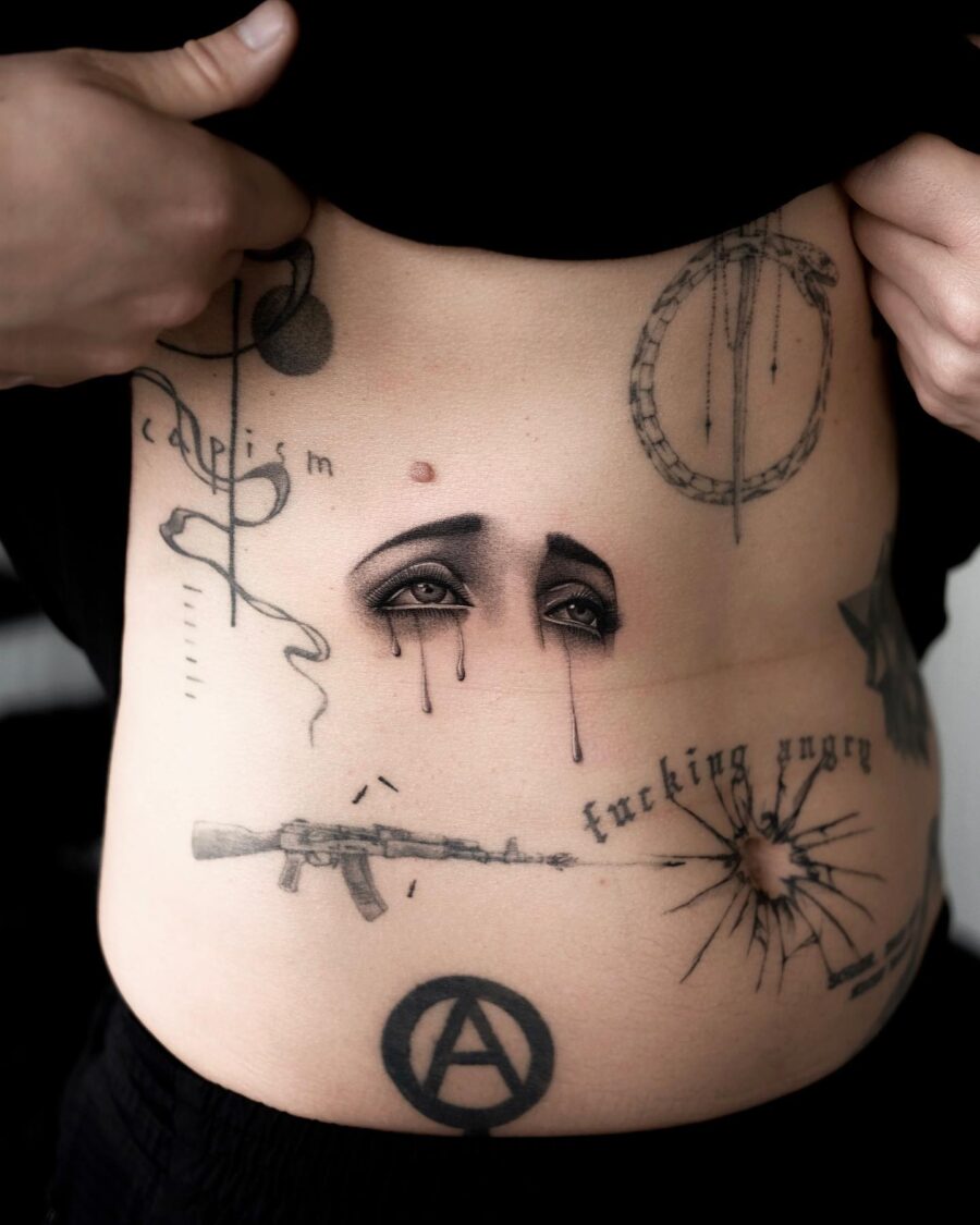 Artistic stomach tattoo reflecting deep emotions Tattoo on skin