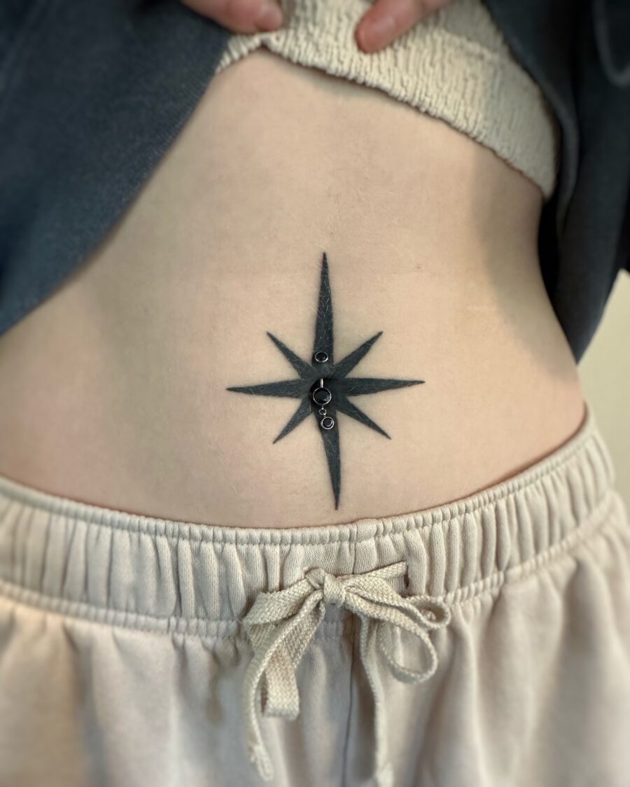 Bold star tattoo accentuating the stomach Tattoo on skin