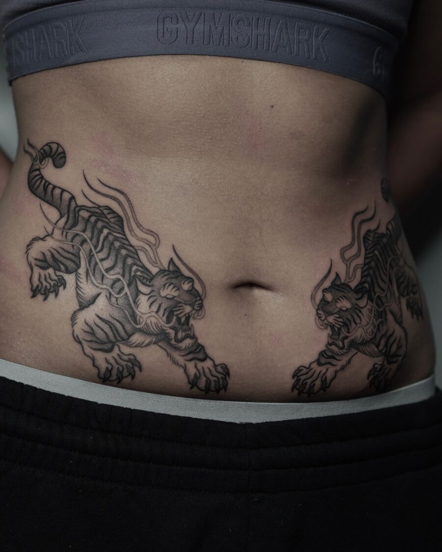 Bold tiger tattoos showcasing fierce aesthetics Tattoo on skin