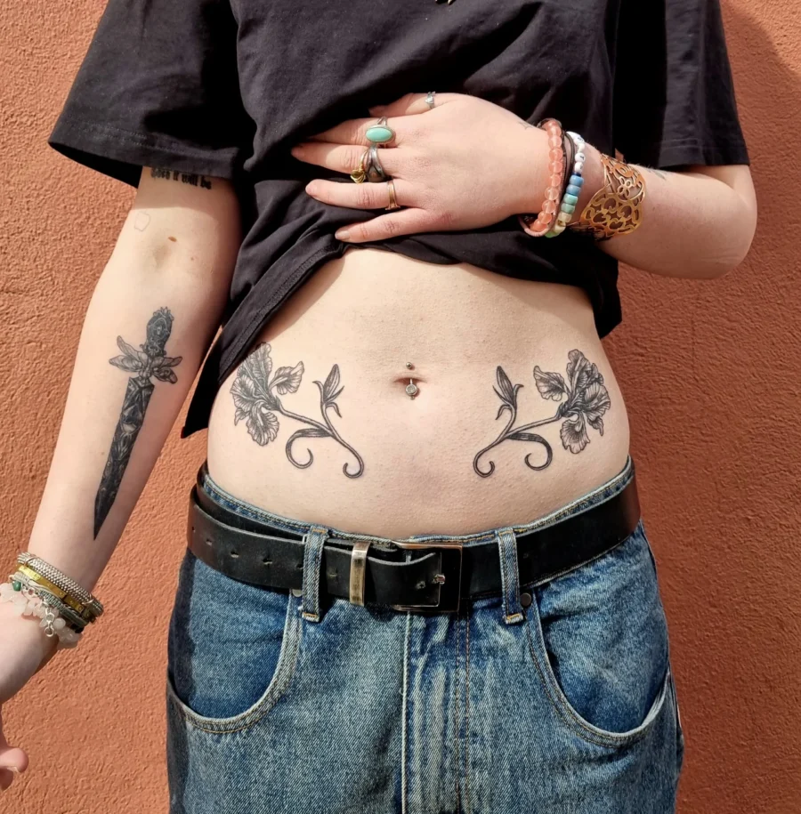Elegant floral design for a stunning belly tattoo Tattoo on skin