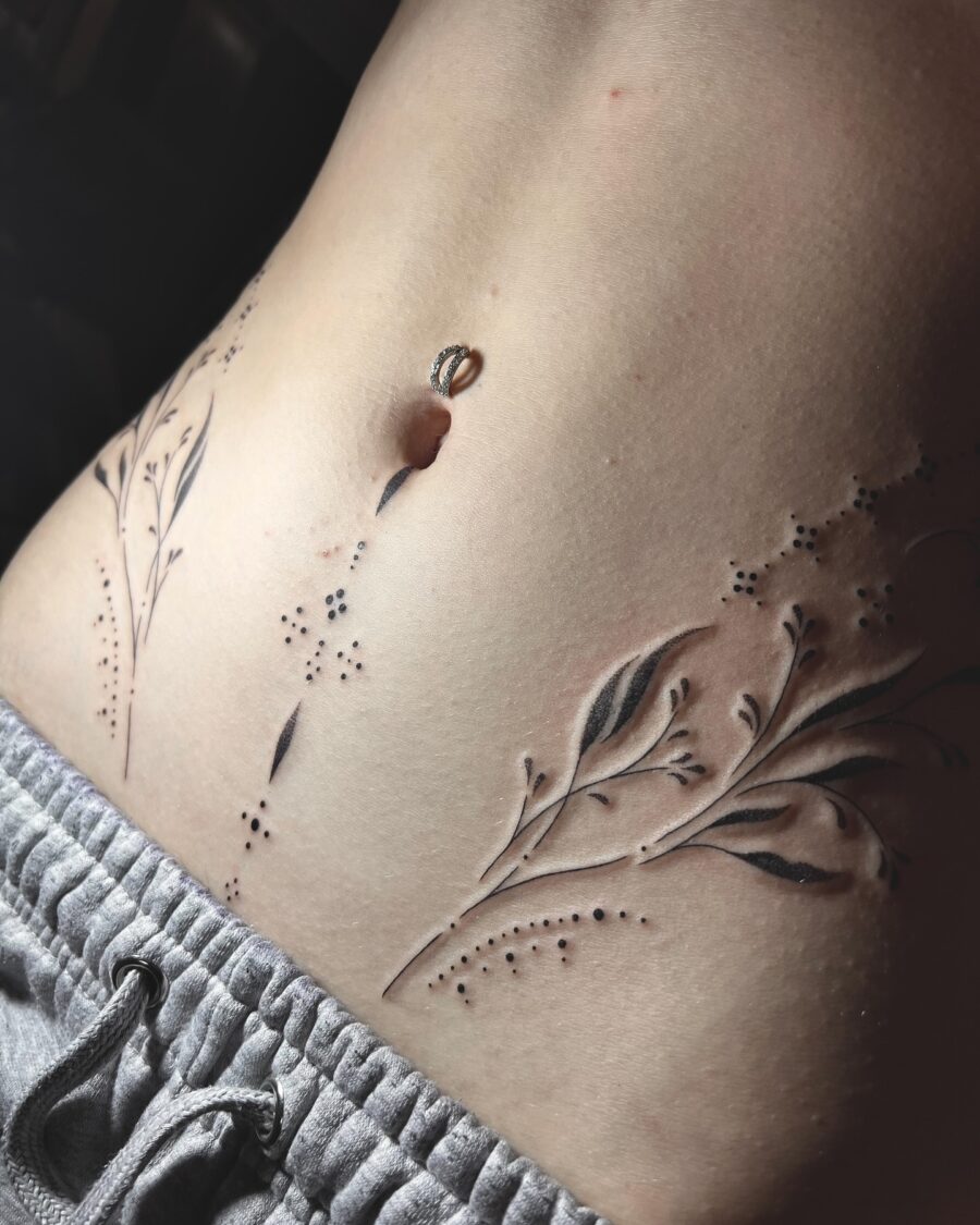 Elegant floral stomach tattoo design in black Tattoo on skin