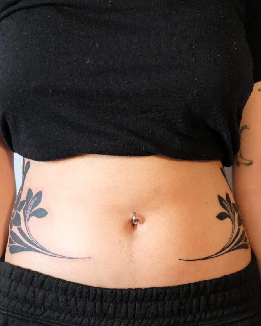 Elegant floral stomach tattoo design Tattoo on skin
