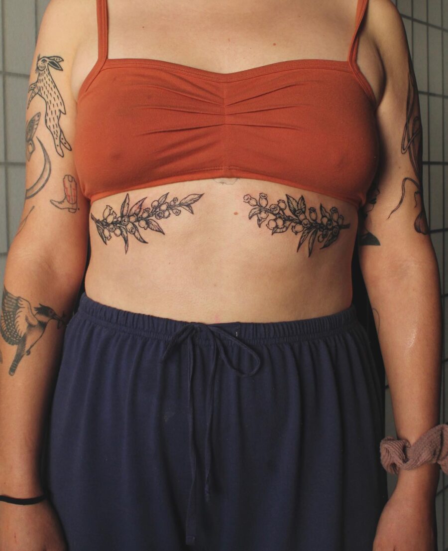 Elegant floral stomach tattoo highlighting body art Tattoo on skin