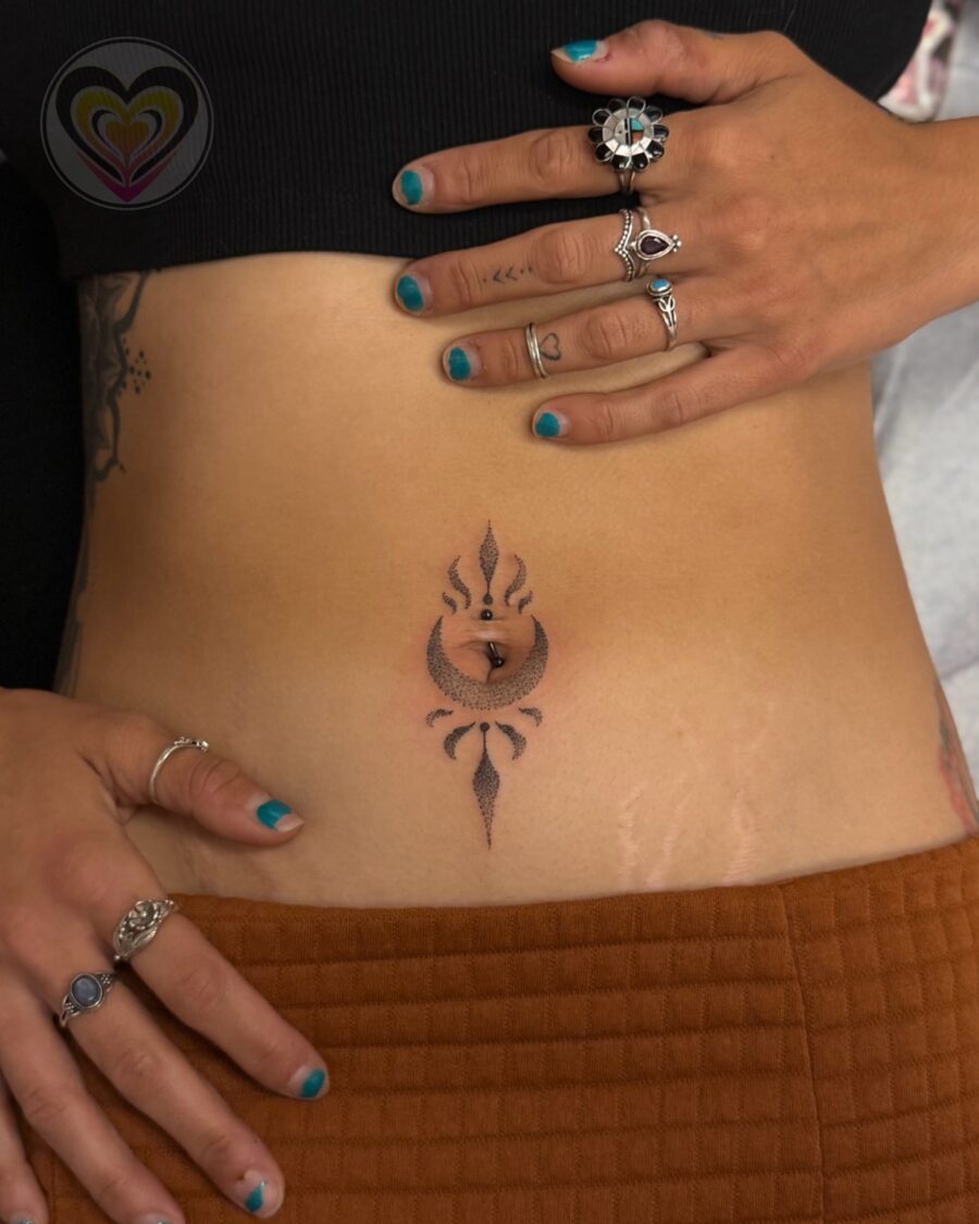 Elegant stomach tattoo design with spiritual flair Tattoo on skin