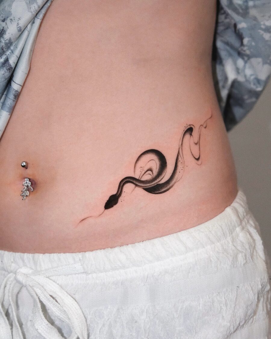 Sleek black snake tattoo flowing gracefully. Tattoo on skin