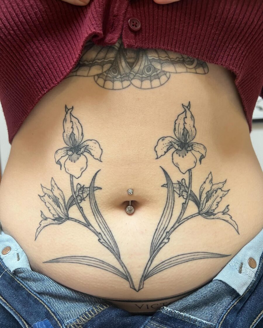 Stunning floral stomach tattoo with belly ring Tattoo on skin