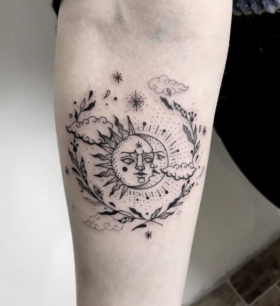 Elaborate Gaze of the Sun and Moon Floral Design Tattoo on skin